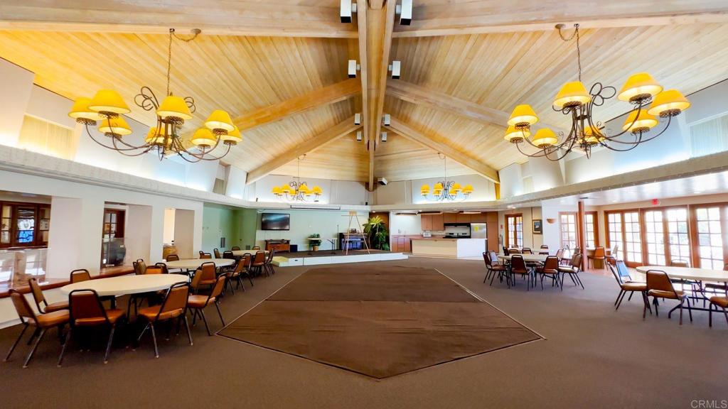 1010 Palm Canyon Drive, Unit 264 Borrego Springs, CA 92004 - Photo 32 of 50 a living room with lots of furniture and a chandelier