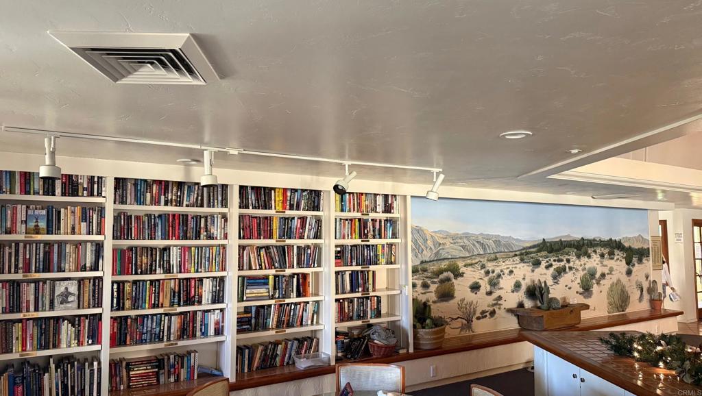 1010 Palm Canyon Drive, Unit 264 Borrego Springs, CA 92004 - Photo 35 of 50 a view of wooden floor and a book shelf