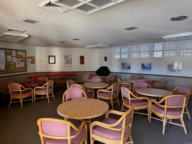 a dinning table and chairs in a room