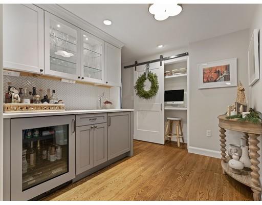 19 Woodridge Road Wellesley, MA 02482 - Photo 13 of 34 a kitchen with stainless steel appliances granite countertop a stove and cabinets
