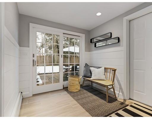 19 Woodridge Road Wellesley, MA 02482 - Photo 15 of 34 a living room with furniture and a floor to ceiling window