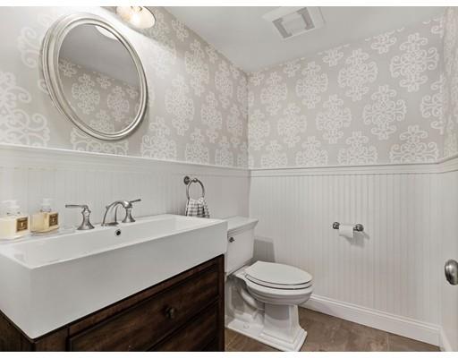19 Woodridge Road Wellesley, MA 02482 - Photo 17 of 34 a bathroom with a toilet a sink and mirror