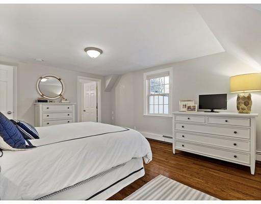 19 Woodridge Road Wellesley, MA 02482 - Photo 19 of 34 a bedroom with a bed and a flat screen tv