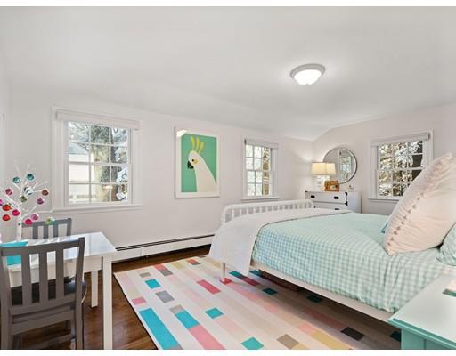 19 Woodridge Road Wellesley, MA 02482 - Photo 23 of 34 a bedroom with a bed and wooden floor