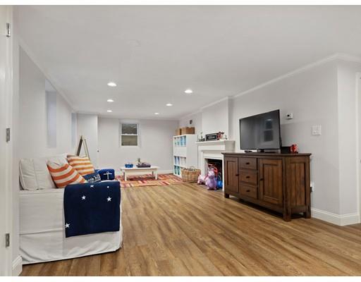 19 Woodridge Road Wellesley, MA 02482 - Photo 26 of 34 a living room with furniture and a flat screen tv