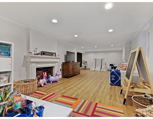 19 Woodridge Road Wellesley, MA 02482 - Photo 27 of 34 a bed room with a bed and a fireplace