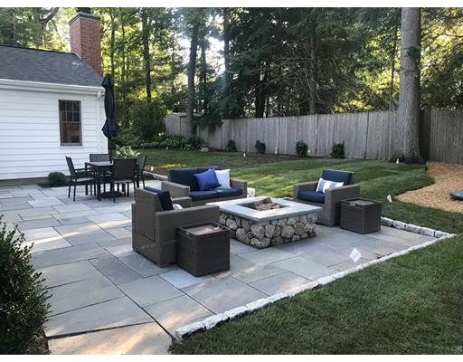 19 Woodridge Road Wellesley, MA 02482 - Photo 31 of 34 a view of a patio with couches chairs and a yard