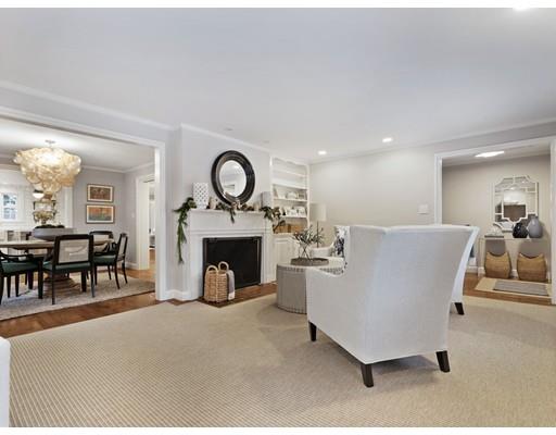 19 Woodridge Road Wellesley, MA 02482 - Photo 5 of 34 a living room with furniture a clock and a fireplace