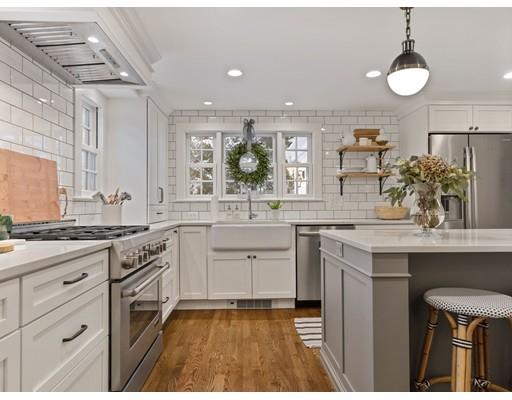 19 Woodridge Road Wellesley, MA 02482 - Photo 8 of 34 a large kitchen with a sink and cabinets