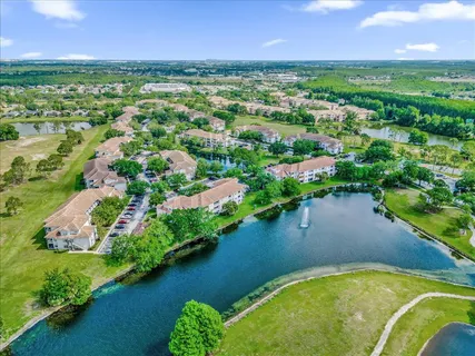 an aerial view of a houses with a lake and lake view