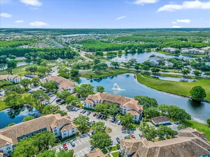 an aerial view of residential houses with outdoor space and garden