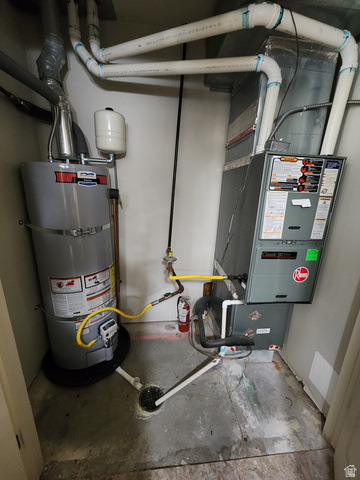 2525 West 450 South, Unit 8 Springville, UT 84663 - Photo 17 of 22 Utility closet housing a water heater, furnace, floor drain, and exposed plumbing