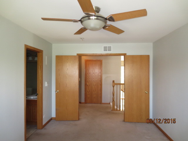 10549 Wakefield Lane Huntley, IL 60142 - Photo 13 of 19 a view of empty room with ceiling fan