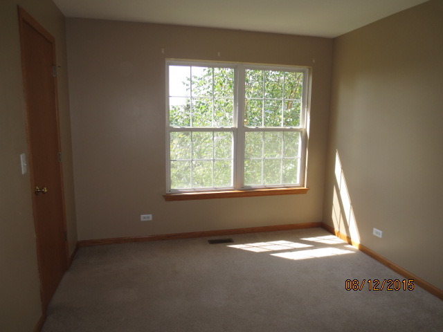 10549 Wakefield Lane Huntley, IL 60142 - Photo 17 of 19 an empty room with a window