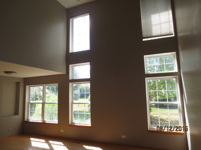 10549 Wakefield Lane Huntley, IL 60142 - Photo 3 of 19 a view of an empty room with a window