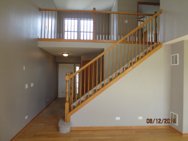 10549 Wakefield Lane Huntley, IL 60142 - Photo 5 of 19 a view of entryway and hall with wooden floor