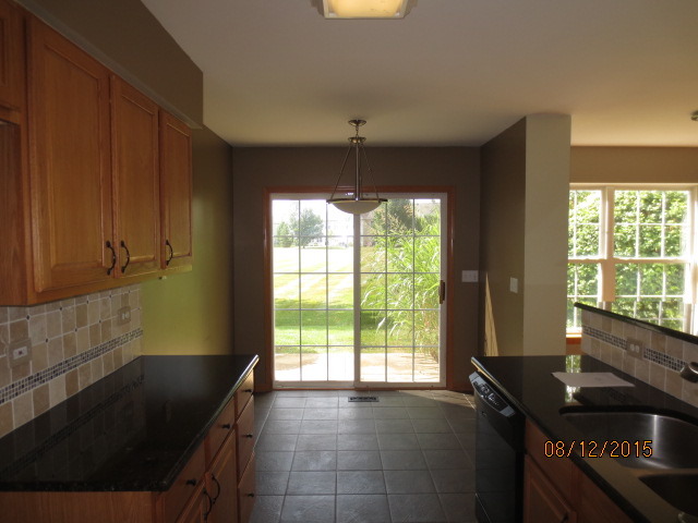 10549 Wakefield Lane Huntley, IL 60142 - Photo 9 of 19 a kitchen that has a sink and a stove