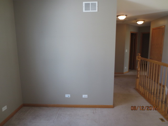 10549 Wakefield Lane Huntley, IL 60142 - Photo 10 of 19 a view of hallway with stairs