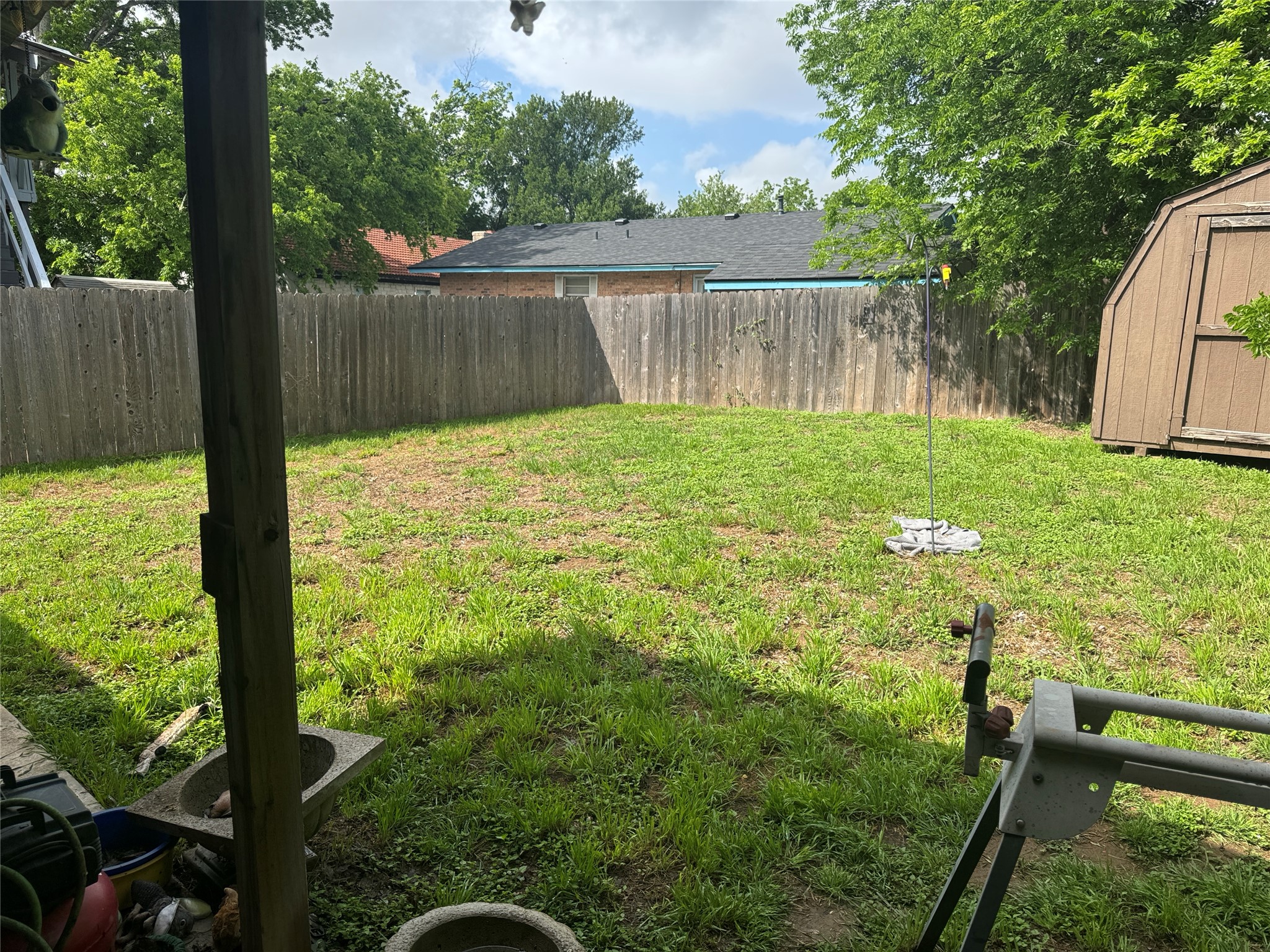 1704 Walnut Street Georgetown, TX 78626 - Photo 2 of 10 Fenced backyard featuring a shed