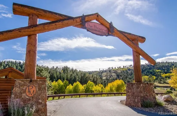 a blue sign that is on the side of a road