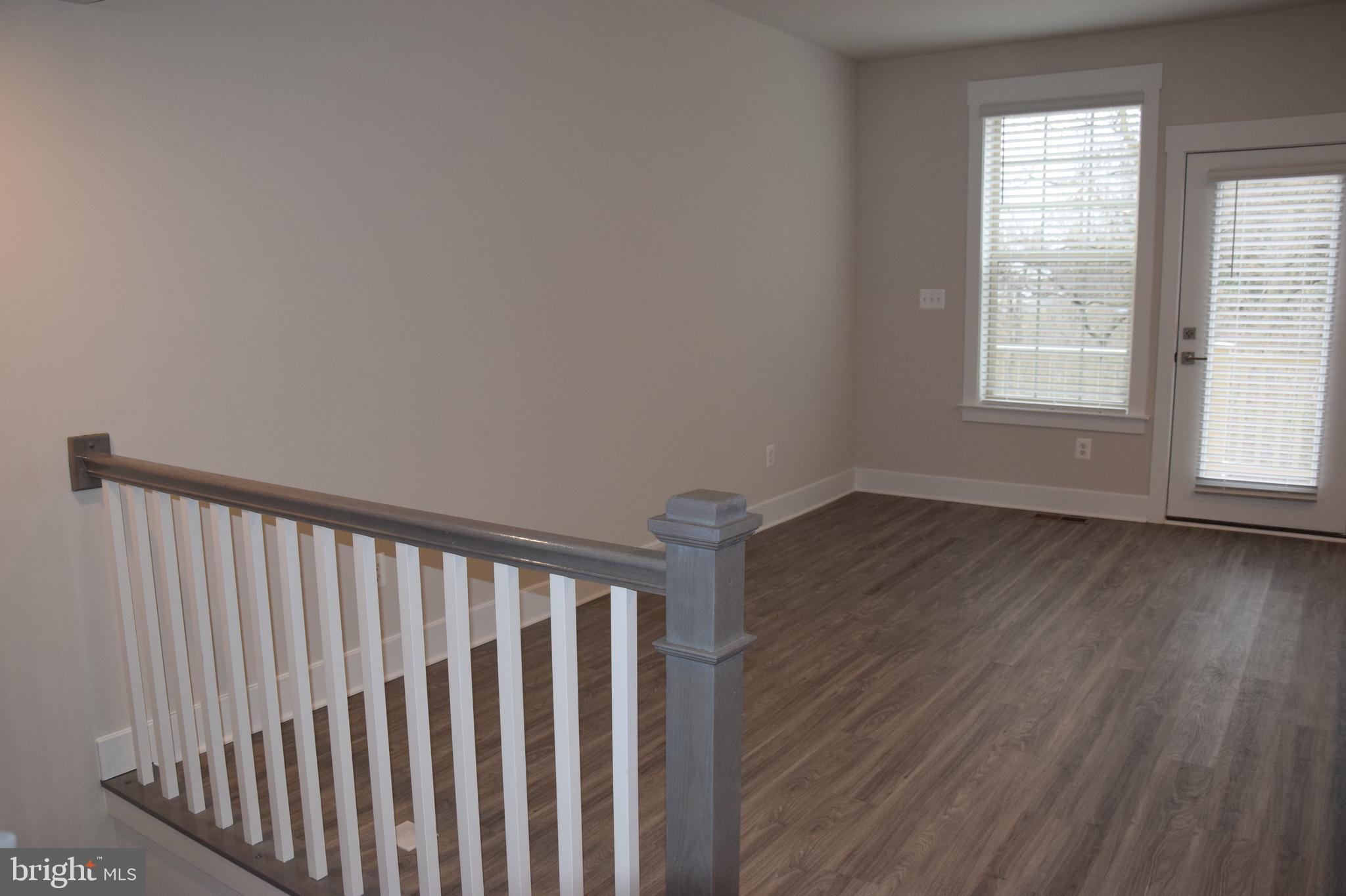 2915 Osprey Way Frederick, MD 21701 - Photo 6 of 27 a view of wooden floor and a window in a room