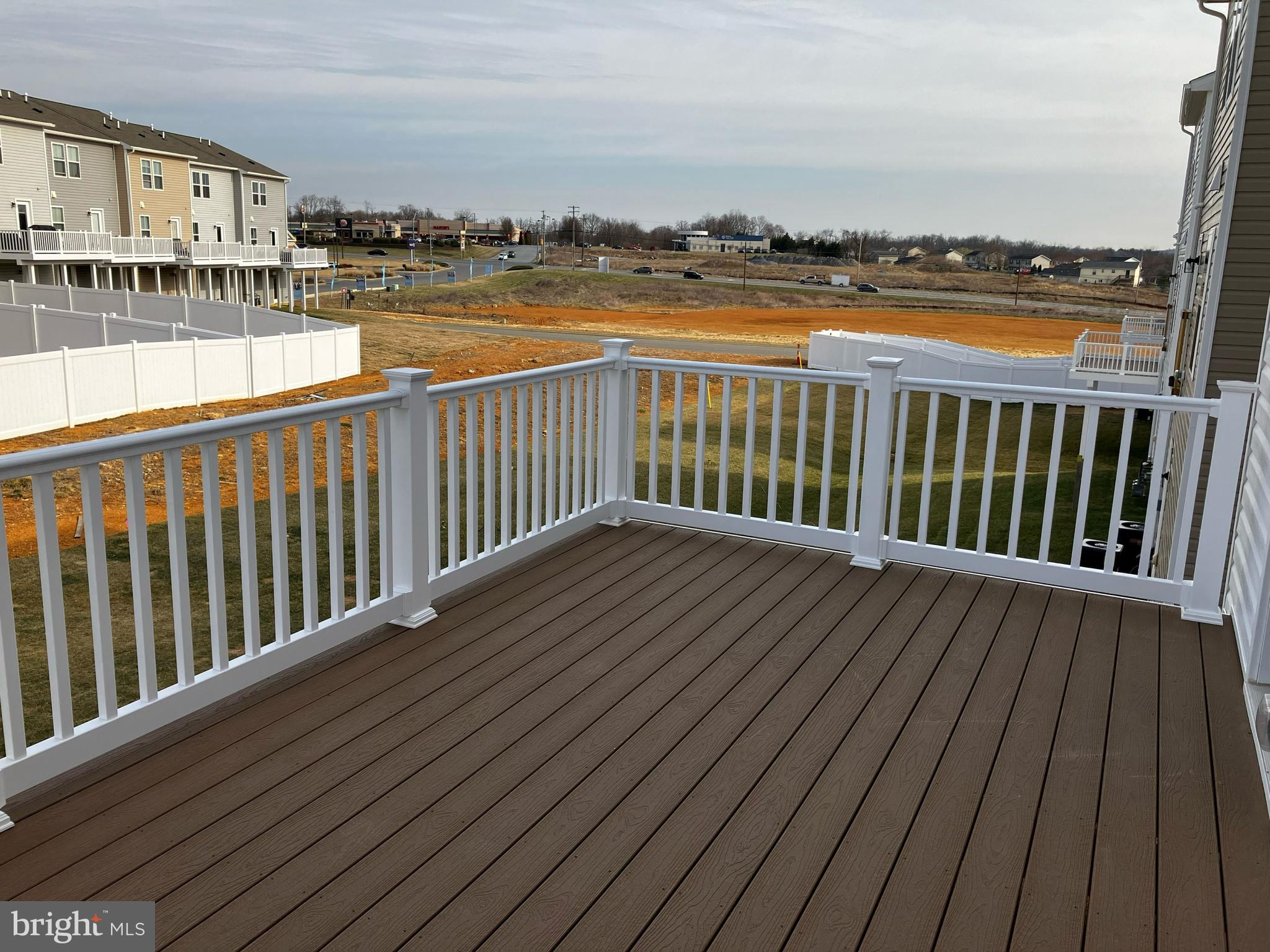 58 Thrower Road Hedgesville, WV 25427 - Photo 13 of 42 a balcony with wooden floor and lake view