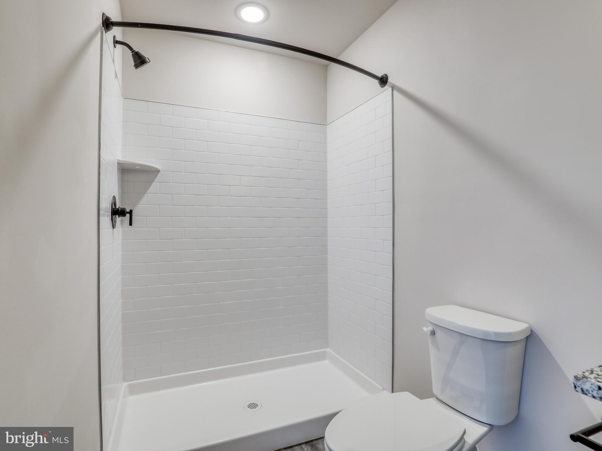 58 Thrower Road Hedgesville, WV 25427 - Photo 30 of 42 a bathroom with a shower and a toilet
