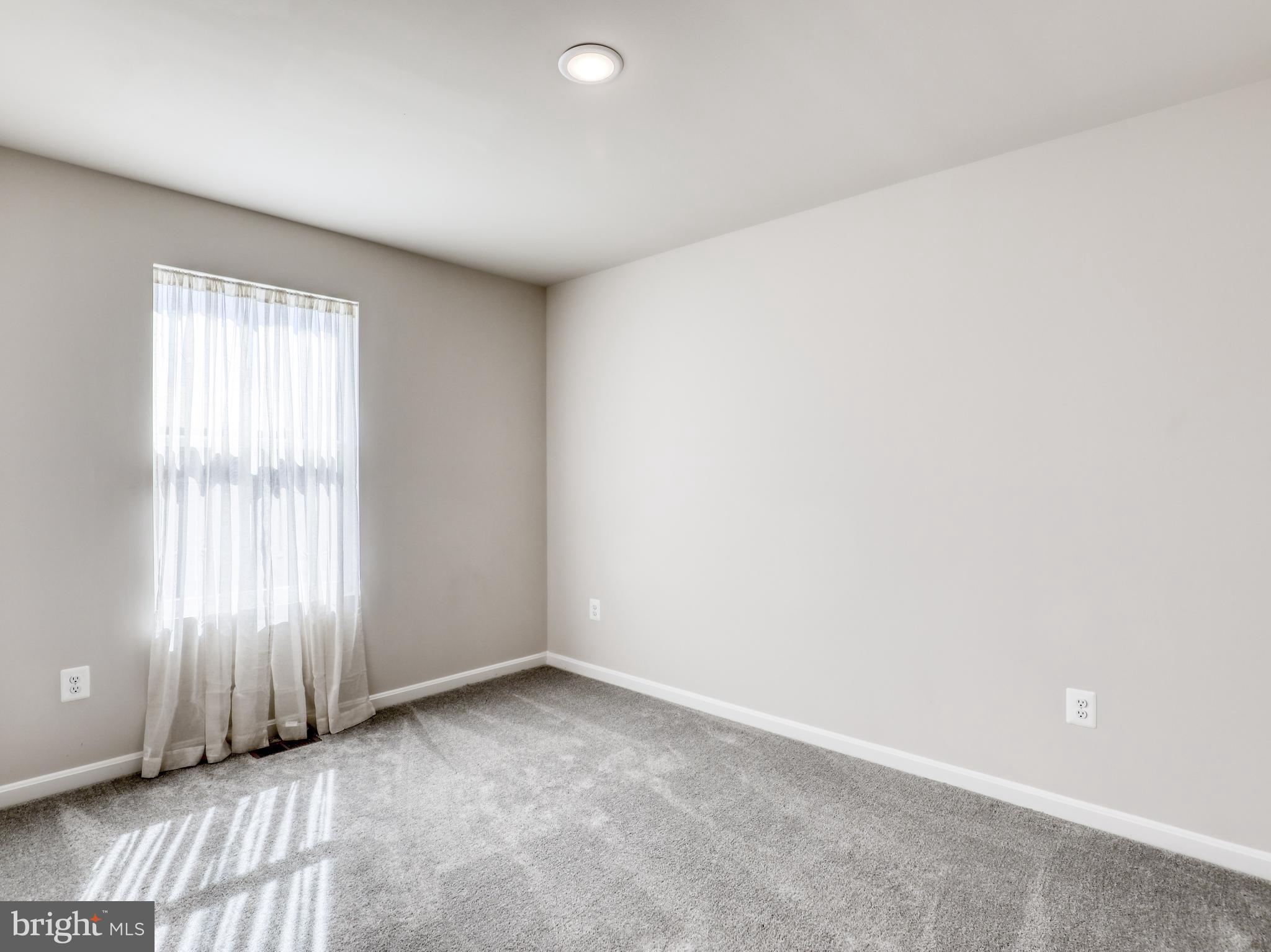 58 Thrower Road Hedgesville, WV 25427 - Photo 31 of 42 an empty room with windows