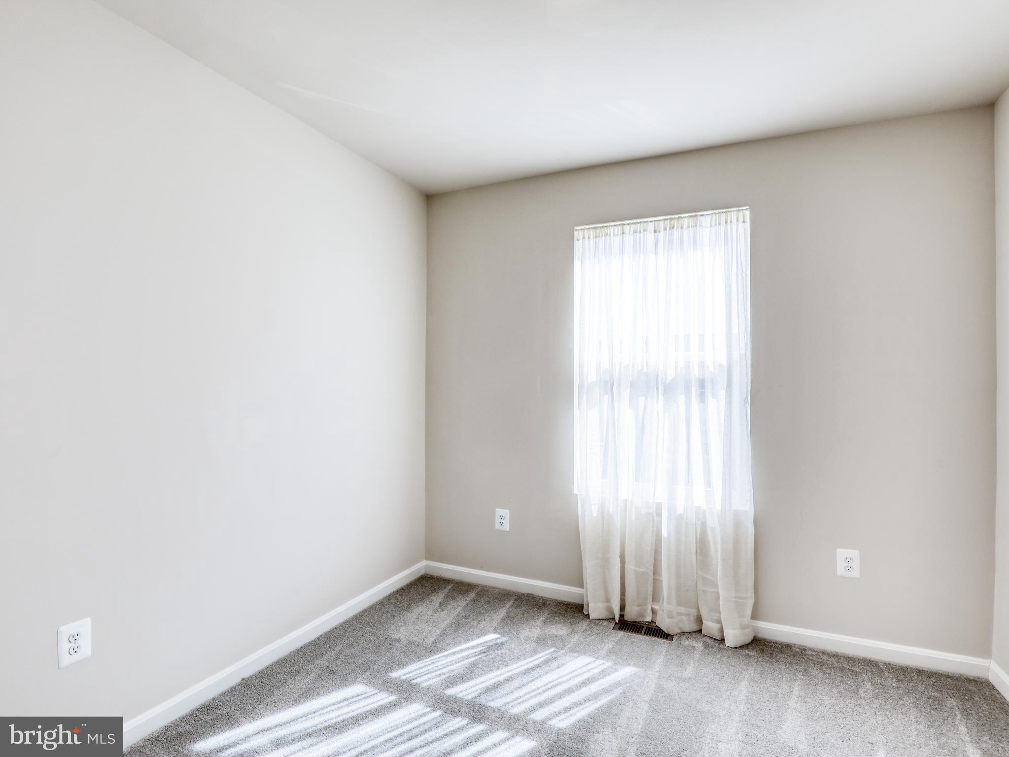 58 Thrower Road Hedgesville, WV 25427 - Photo 32 of 42 an empty room with wooden floor and windows