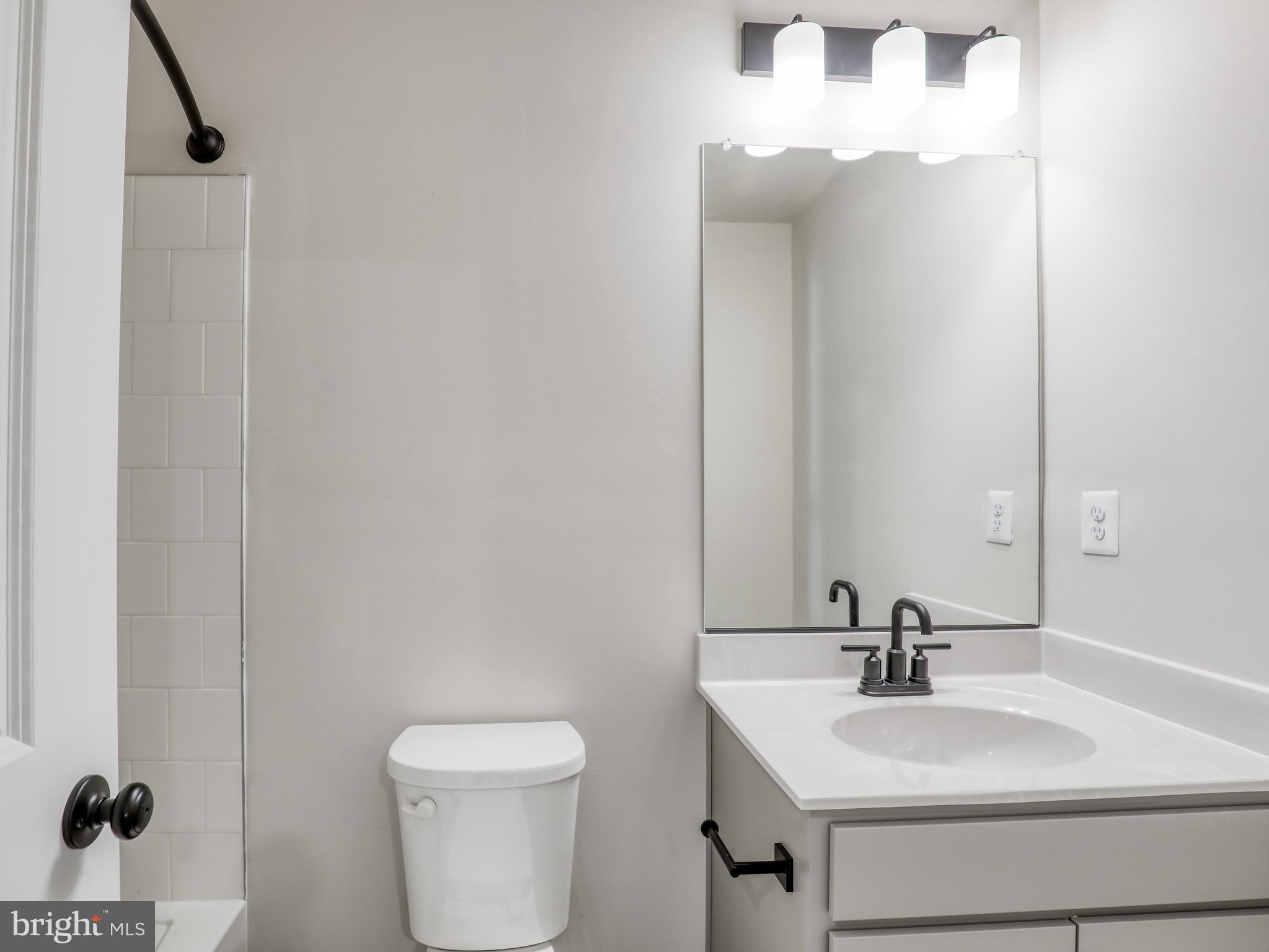 58 Thrower Road Hedgesville, WV 25427 - Photo 33 of 42 a bathroom with a toilet sink and mirror