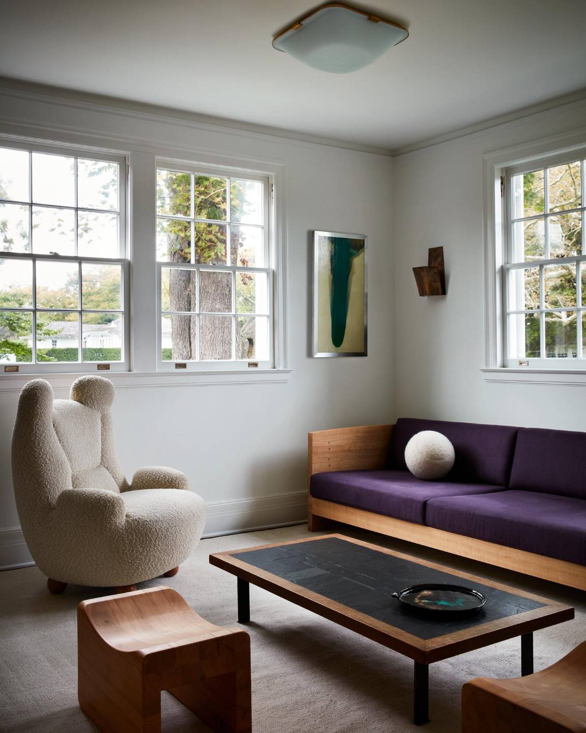 121 Further Lane East Hampton, NY 11937 - Photo 21 of 23 a living room with furniture a window and a chandelier