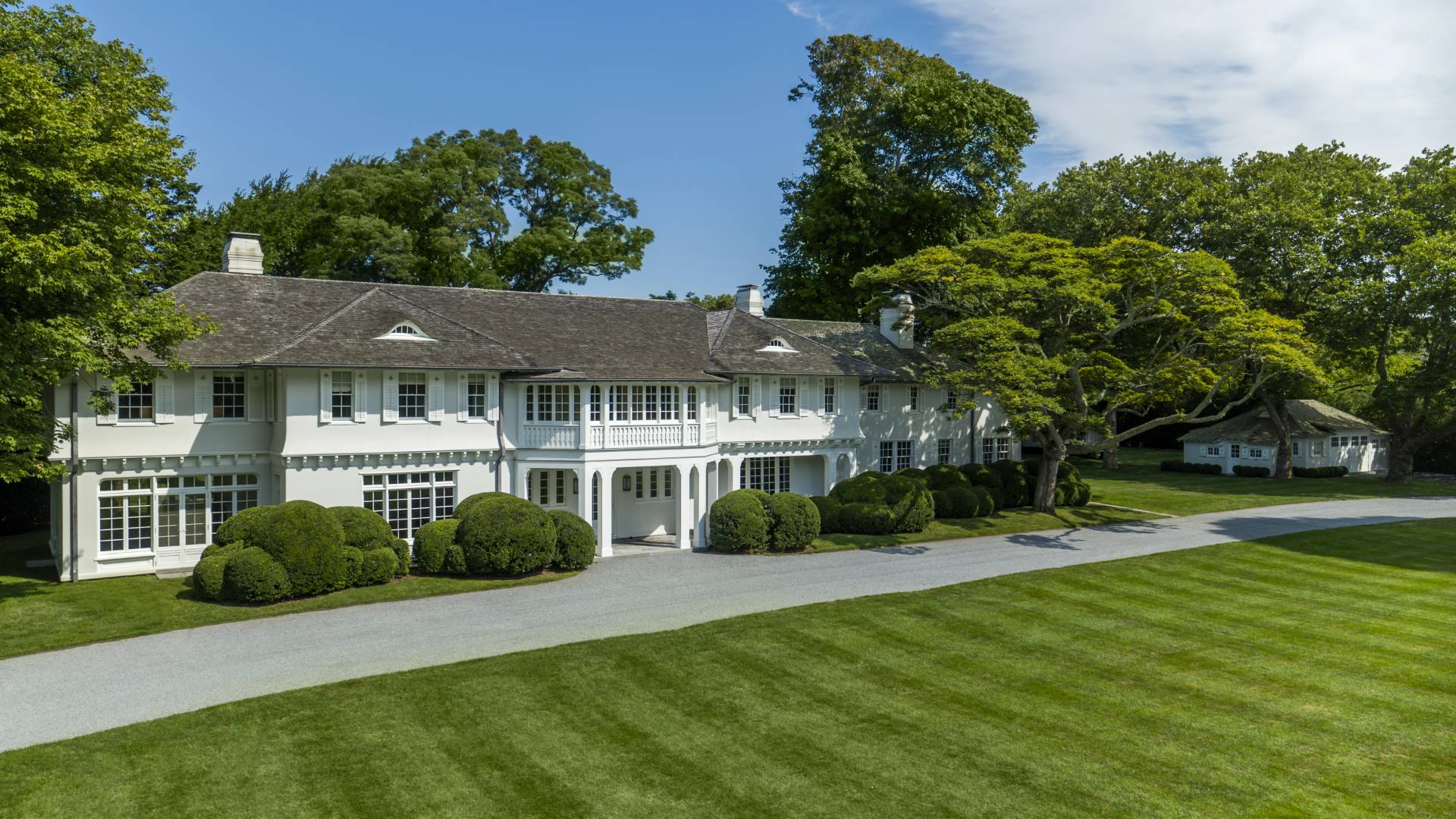 121 Further Lane East Hampton, NY 11937 - Photo 3 of 23 a front view of a house with a yard
