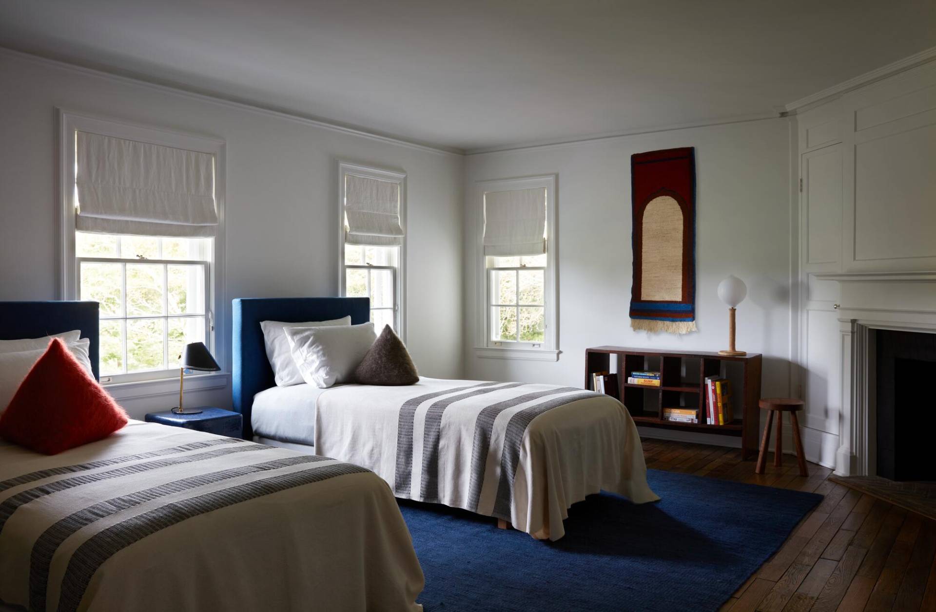 121 Further Lane East Hampton, NY 11937 - Photo 7 of 23 a bedroom with two beds and a fireplace
