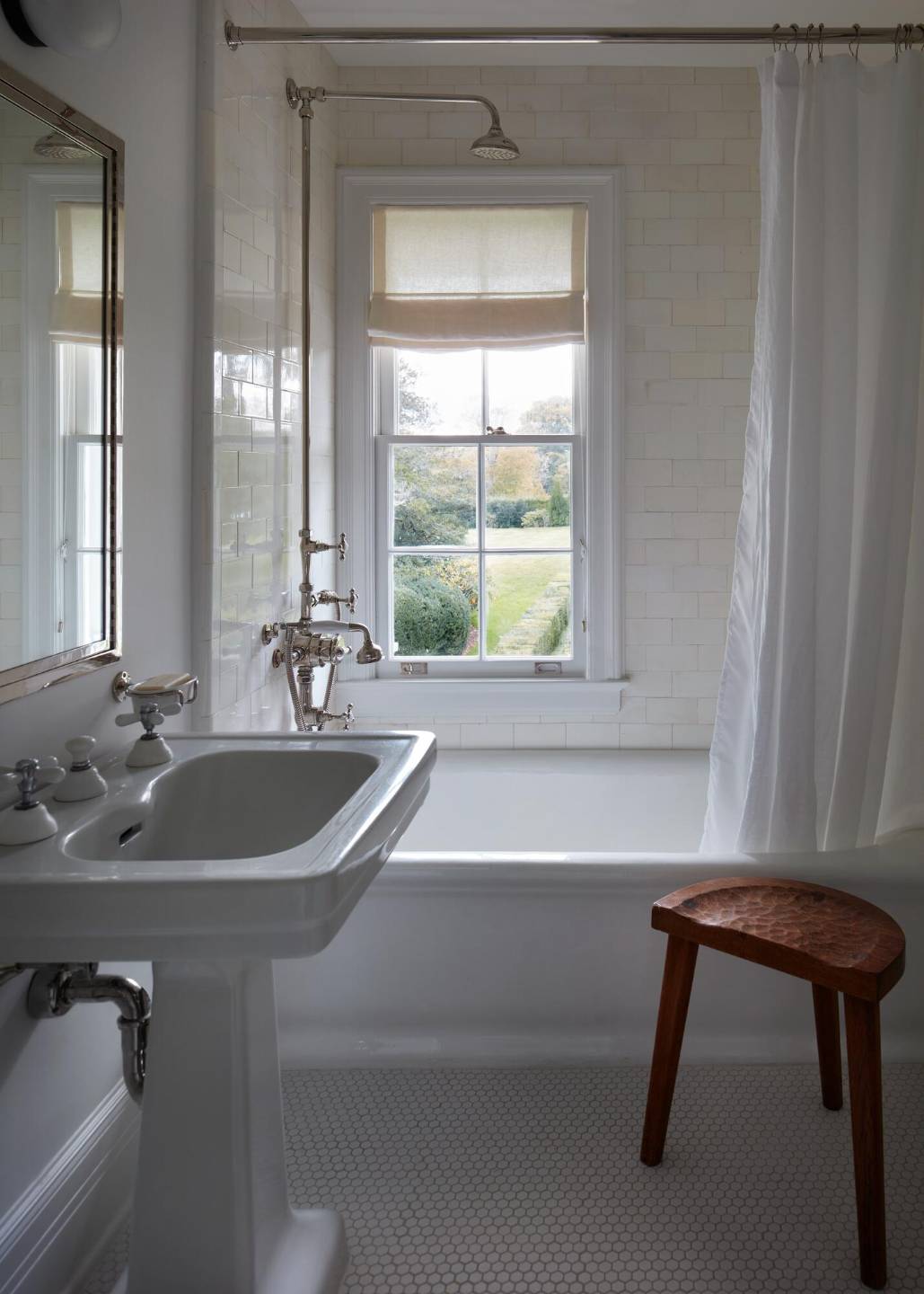 121 Further Lane East Hampton, NY 11937 - Photo 8 of 23 a bathroom with a sink and a bathtub