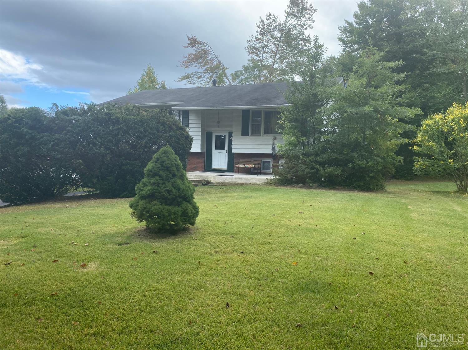 4 Holiday Road Manalapan, NJ 07726 - Photo 1 of 9 a view of a house with backyard and garden