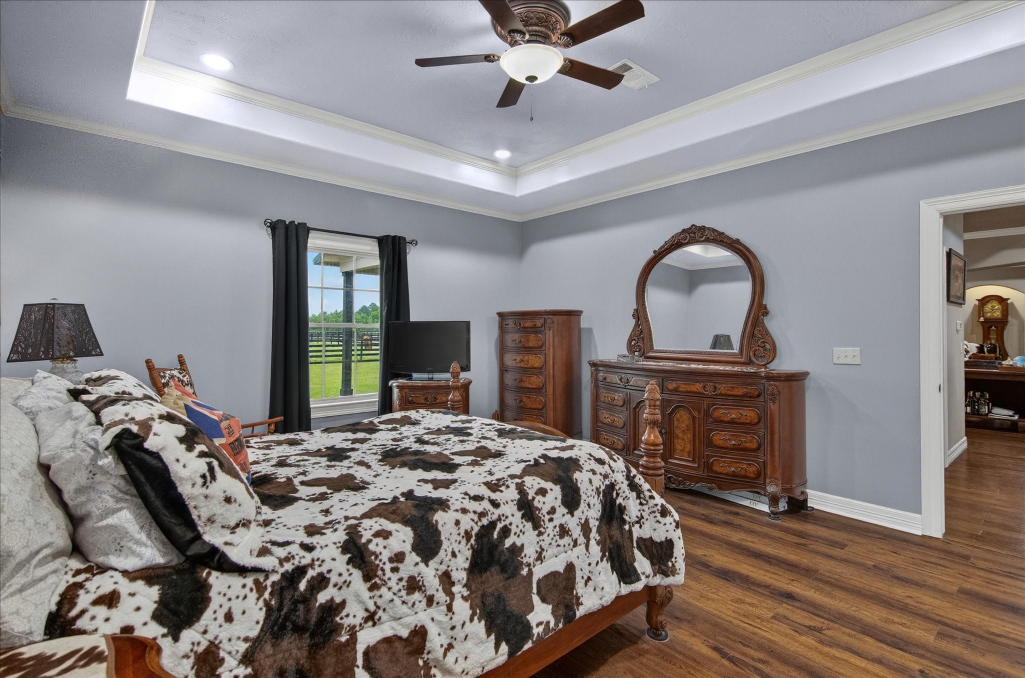 1755 McBride-Devillier Loop Winnie, TX 77665 - Photo 21 of 44 a bed sitting in a bedroom next to a window and a fireplace