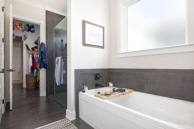 a bathroom with a sink and a refrigerator
