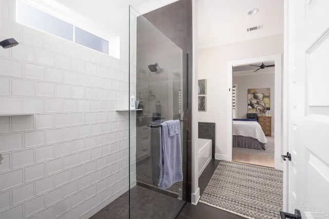 a view of walk in closet with clothes