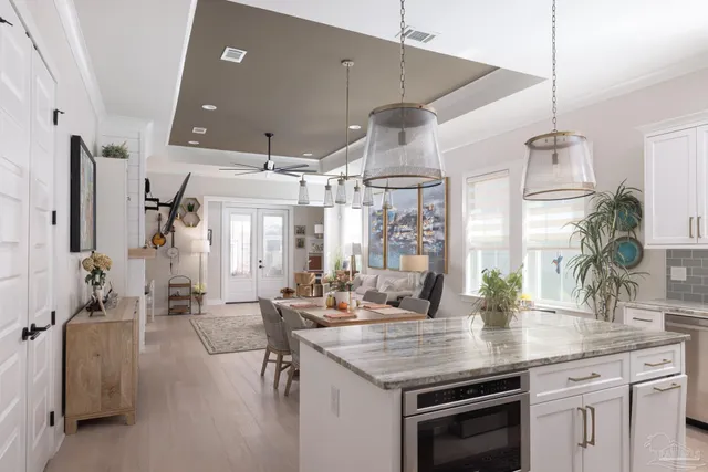 a kitchen with counter top space and stainless steel appliances