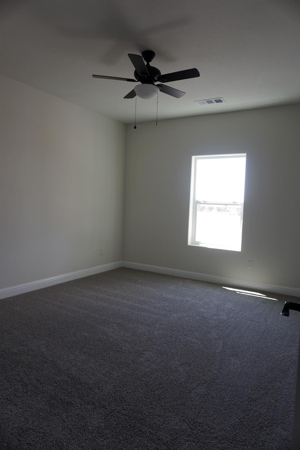 16398 Road 37 Madera, CA 93636 - Photo 12 of 23 an empty room with a window