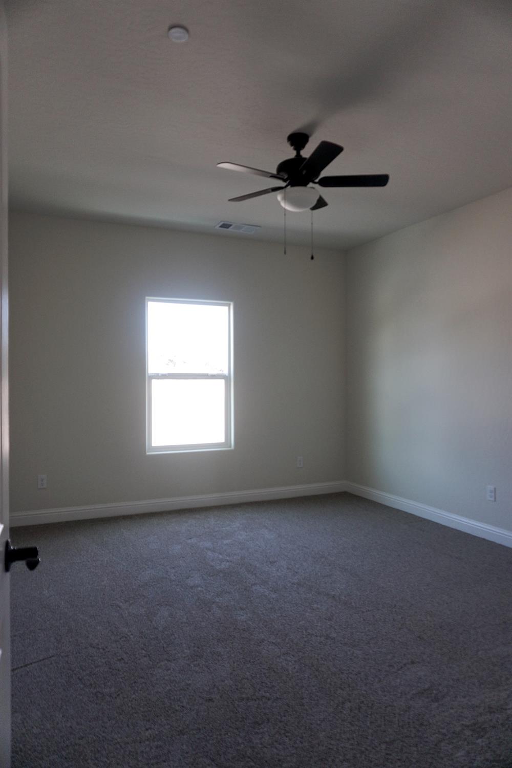 16398 Road 37 Madera, CA 93636 - Photo 13 of 23 an empty room with a window
