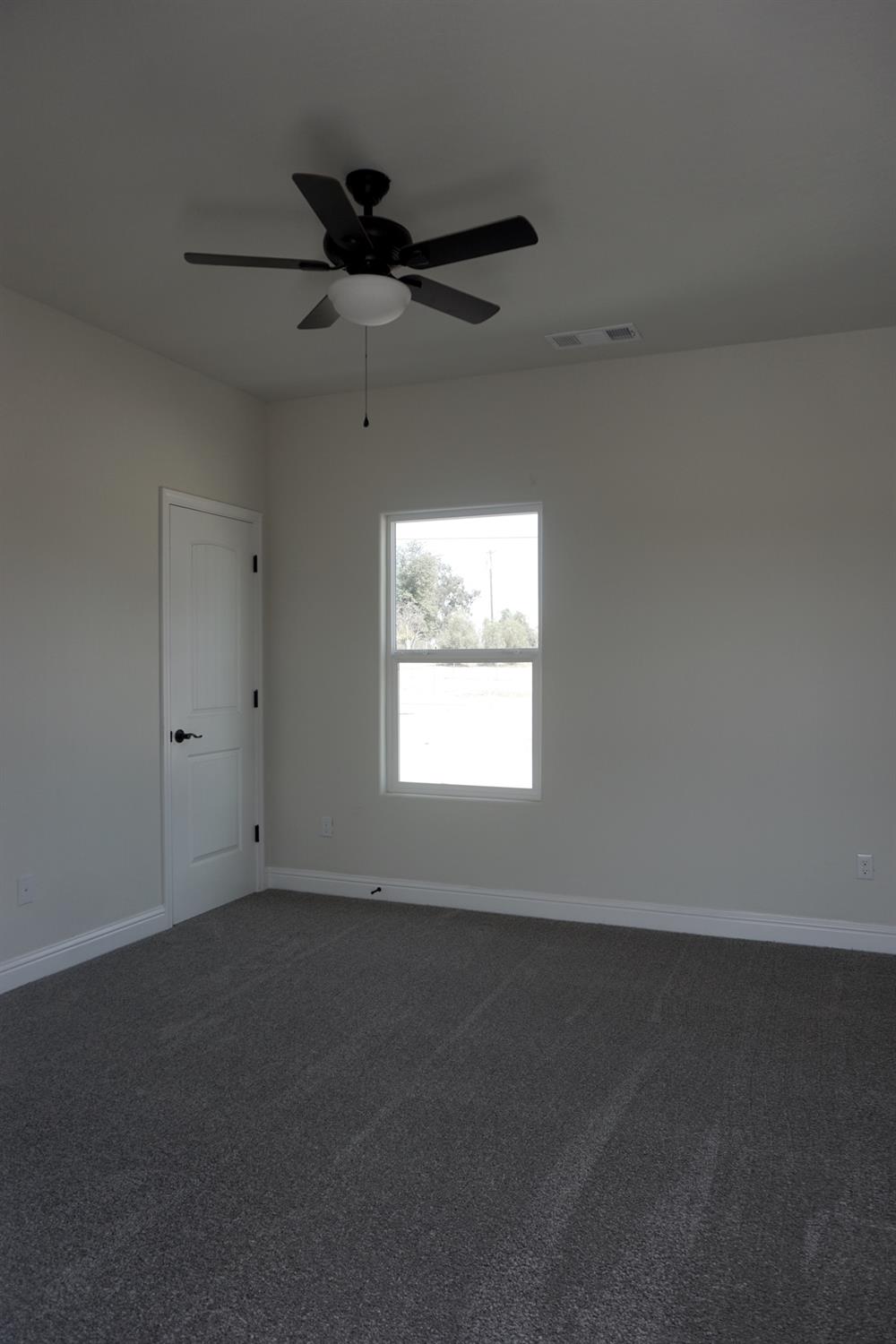 16398 Road 37 Madera, CA 93636 - Photo 16 of 23 an empty room with a window