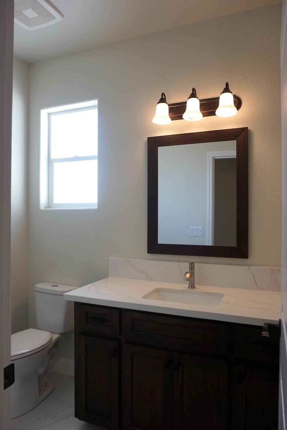 16398 Road 37 Madera, CA 93636 - Photo 17 of 23 a bathroom with a sink and a toilet