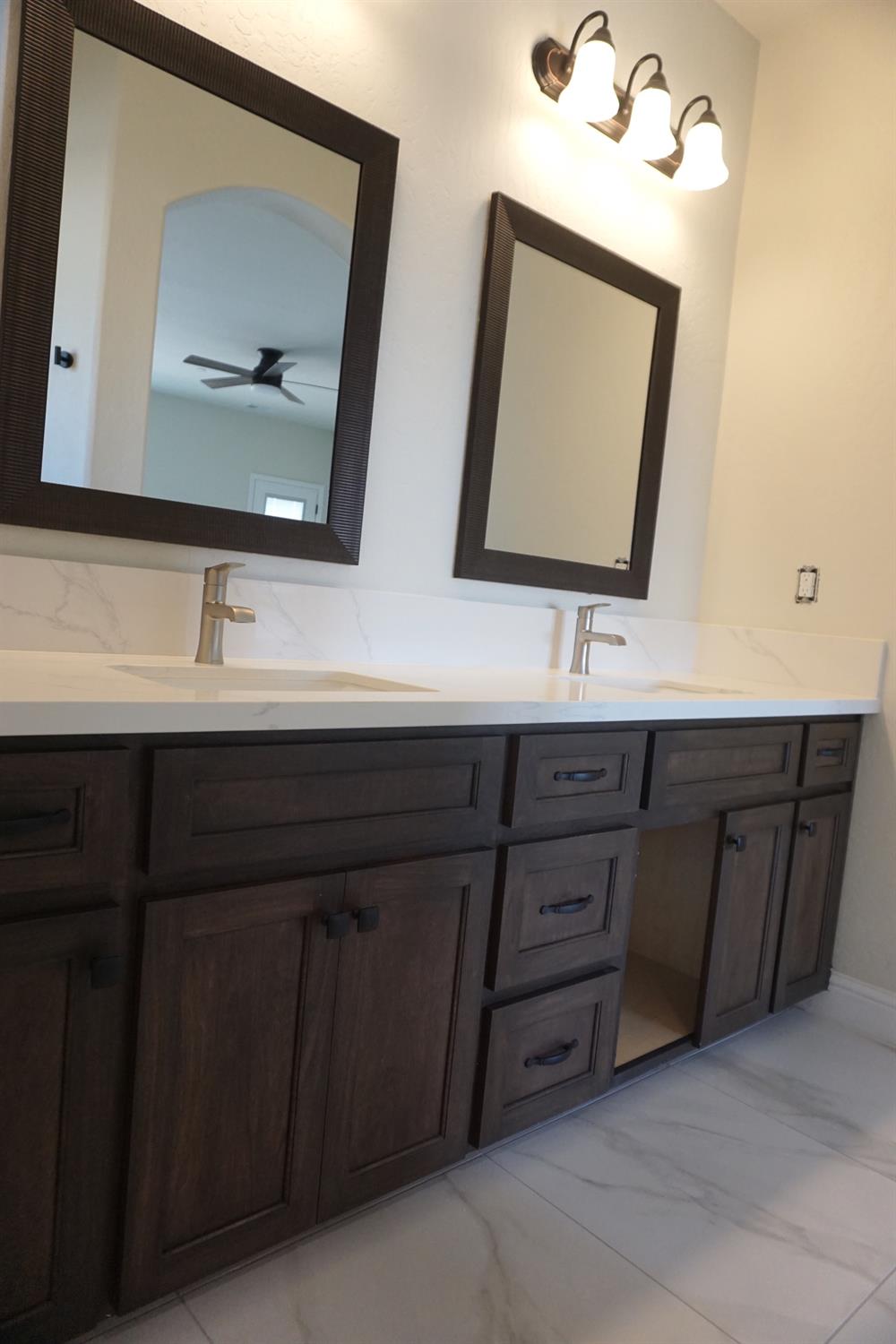 16398 Road 37 Madera, CA 93636 - Photo 10 of 23 a bathroom with a double vanity sink and mirror