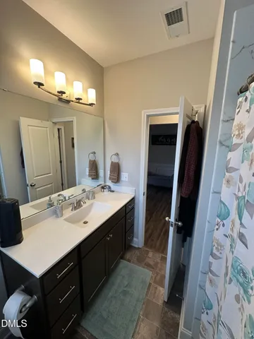 a bathroom with a shower and a tub
