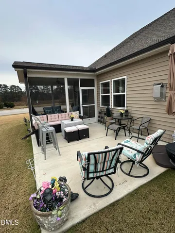 a front view of house with yard and car parked