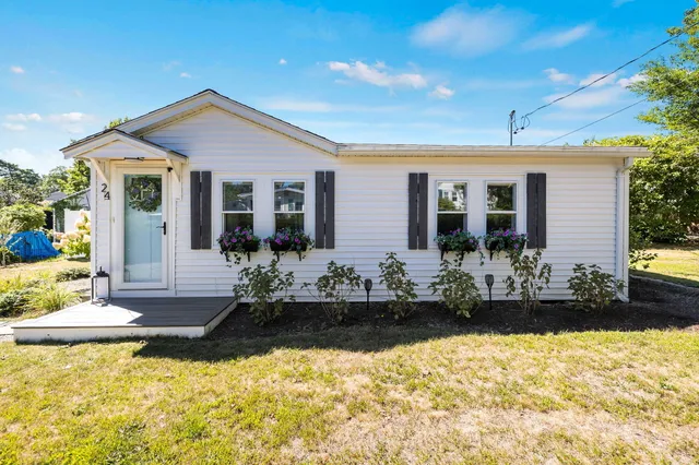 a front view of a house with a yard