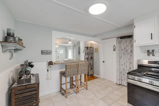 a kitchen with furniture and a stove