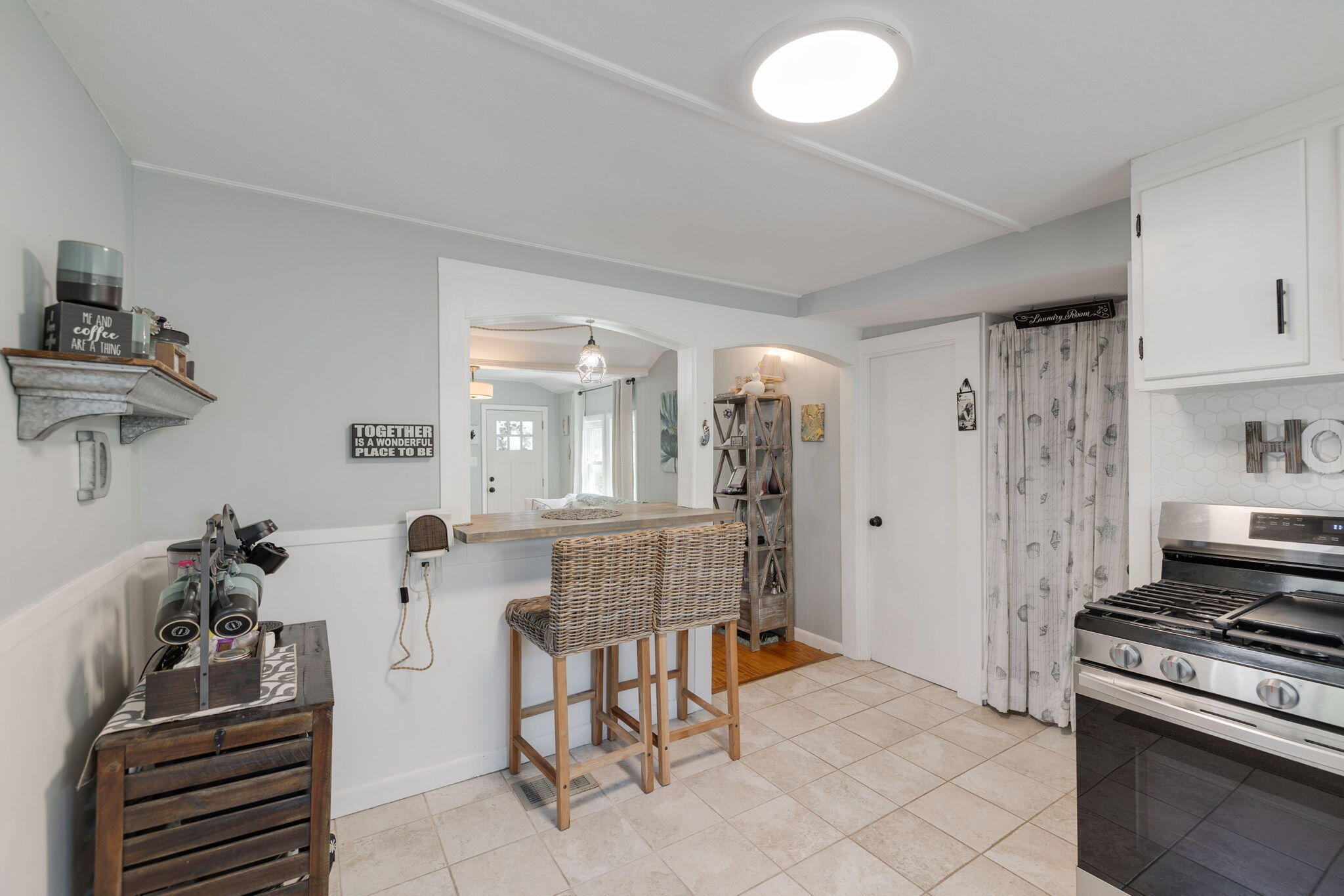 24 Butler Street Buzzards Bay, MA 02532 - Photo 11 of 37 a kitchen with furniture and a stove