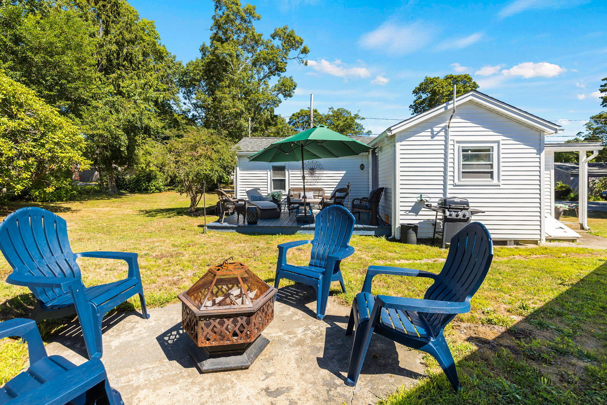 24 Butler Street Buzzards Bay, MA 02532 - Photo 22 of 37 a view of a chairs and table in the patio